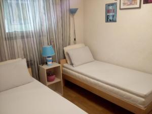 Ένα ή περισσότερα κρεβάτια σε δωμάτιο στο Apartman Teuta Zagreb