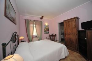 Postel nebo postele na pokoji v ubytování Romantica Pucci