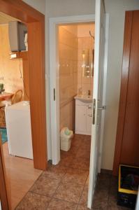 a bathroom with a toilet and a sink and a shower at Budziar - kwatery nad morzem in Darłowo
