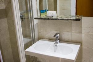 Koupelna v ubytování Hotel Tempio Di Pallade