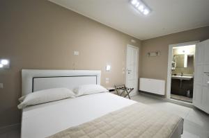 Postel nebo postele na pokoji v ubytování Hotel Residence Il Gabbiano