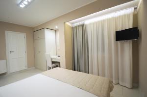 TV a/nebo společenská místnost v ubytování Hotel Residence Il Gabbiano