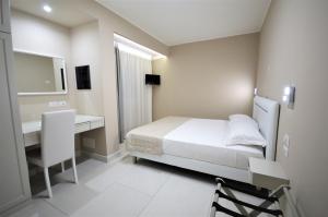 Postel nebo postele na pokoji v ubytování Hotel Residence Il Gabbiano