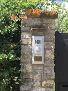 a stone wall with a pay box on it at La Casina di Eleonora in Mosciano