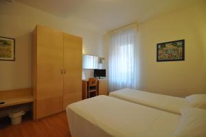 Postel nebo postele na pokoji v ubytování Hotel Igea