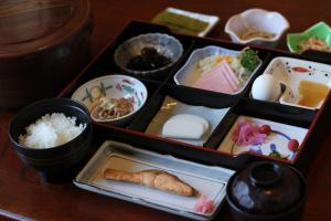a tray of food with rice and other foods at Hotel Kinu in Nikko
