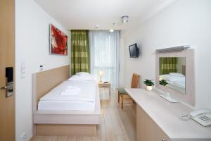 TV a/nebo společenská místnost v ubytování Hotel Ankora
