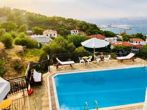 a swimming pool with a view of the ocean at Rooms Olympia in Gialiskari +37 photos