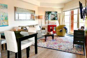 a living room with a couch and a table at Copper Oasis in West Kelowna