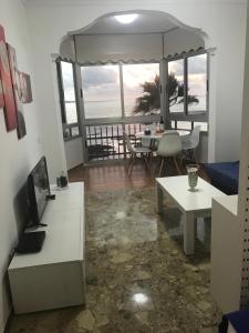 a living room with a view of the ocean at Apartamentos 306 -05 vista Teide in Las Palmas de Gran Canaria