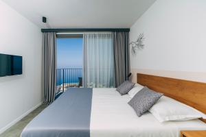 Postel nebo postele na pokoji v ubytování MORENIA All Inclusive Hotel