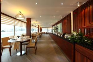a dining room with tables and chairs in a restaurant at Victory Hotel & Spa Istanbul in Istanbul