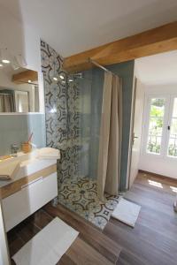 a bathroom with a shower and a sink at Domaine Chateau Martin in Saint-Tropez