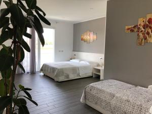Postel nebo postele na pokoji v ubytování B&B Villa del Lago
