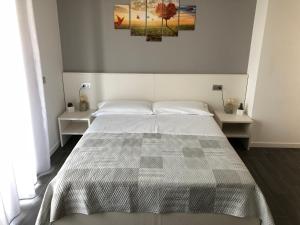 Postel nebo postele na pokoji v ubytování B&B Villa del Lago
