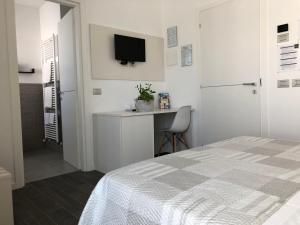 Postel nebo postele na pokoji v ubytování B&B Villa del Lago