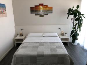 Postel nebo postele na pokoji v ubytování B&B Villa del Lago