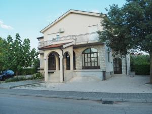 a house on the side of a street at Apartment Ivan-Experience 3 Bedrooms in Ljubuški