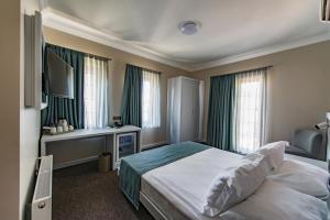 Postel nebo postele na pokoji v ubytování Elia Hotel Cunda by Ortunc