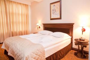 Postel nebo postele na pokoji v ubytování Hotel Bellaria