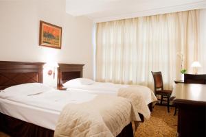 Postel nebo postele na pokoji v ubytování Hotel Bellaria