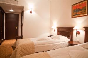 Postel nebo postele na pokoji v ubytování Hotel Bellaria