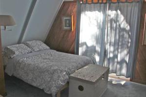 Katil atau katil-katil dalam bilik di Flagstaff Chalet