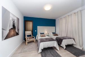 Postel nebo postele na pokoji v ubytování Luxury Beach Apartments