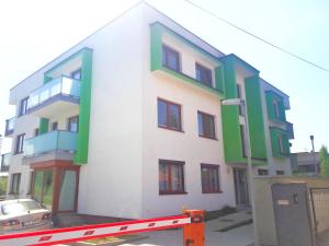 a building that is being built on the street at Dream LUX Apartments in Kraków