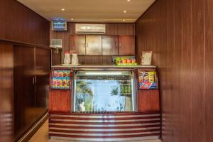 a food stand in a room with wooden walls at Al Muhaidb Al Hada Resort in Al Hada