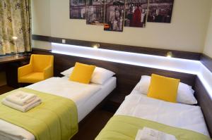 Posteľ alebo postele v izbe v ubytovaní Hotel Uno