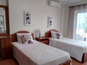Postel nebo postele na pokoji v ubytování Hotel Rural Rocha da Gralheira
