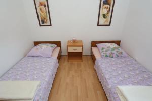 Postel nebo postele na pokoji v ubytování Villa Neyla