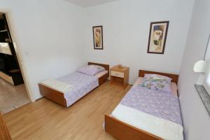 Postel nebo postele na pokoji v ubytování Villa Neyla