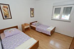 Postel nebo postele na pokoji v ubytování Villa Neyla