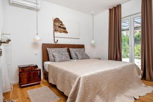 Postel nebo postele na pokoji v ubytování Arka Trogir apartments - Seget Vranjica