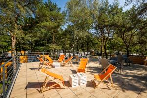 a group of chairs and tables on a patio at PARK45 in Sopot