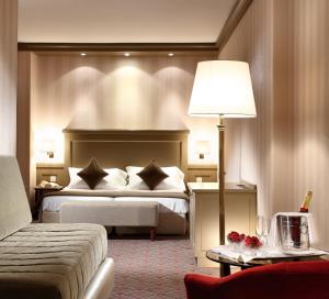 Letto o letti in una camera di Hotel De La Paix