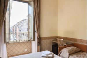 Postel nebo postele na pokoji v ubytování Alex Romano