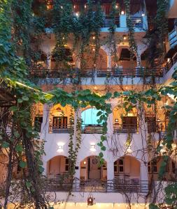 a building with a bunch of plants on it at Inn Seventh Heaven in Pushkar