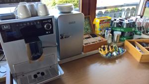 a coffee maker sitting on top of a counter at Gästehaus am Berg in Bayerisch Eisenstein
