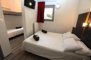 Letto o letti in una camera di Hôtel La Chartreuse