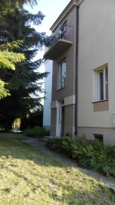 a building with a balcony on the side of it at Apartament Blue in Krosno