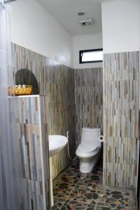 a bathroom with a toilet and a sink at Nubdao Resort&Restaurant in Nong Prue