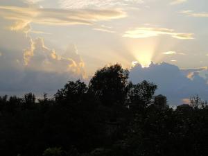 The sunrise or sunset as seen from a vendégházakat or nearby