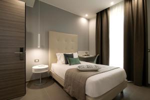 Postel nebo postele na pokoji v ubytování Hotel H21
