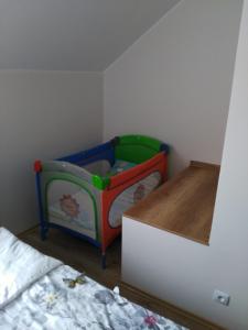 Posteľ alebo postele v izbe v ubytovaní Apartament Słoneczny