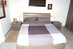 A bed or beds in a room at Le stelle di Portisco