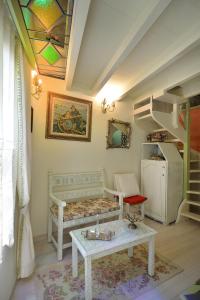 a room with a bed and a table and a staircase at Casa della Favola Boutique Hotel in Chania