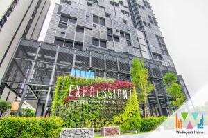 a tall building with a sign in front of it at Expressionz KLCC by Wodages in Kuala Lumpur